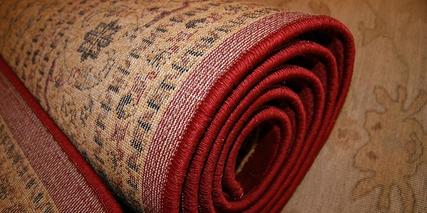 An image of a rug resembling colourful handwoven Saudi rugs with traditional geometric patterns.