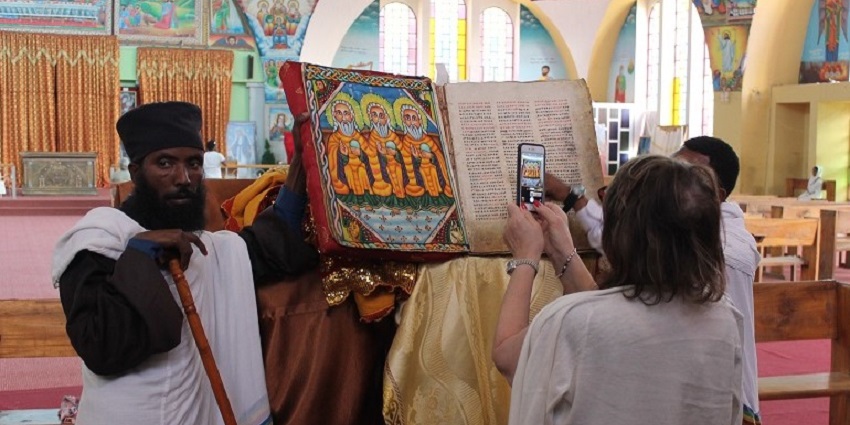 Pilgrims gather in white robes at Axum’s Church of St. Mary for Hidar Tsion in Ethiopia.