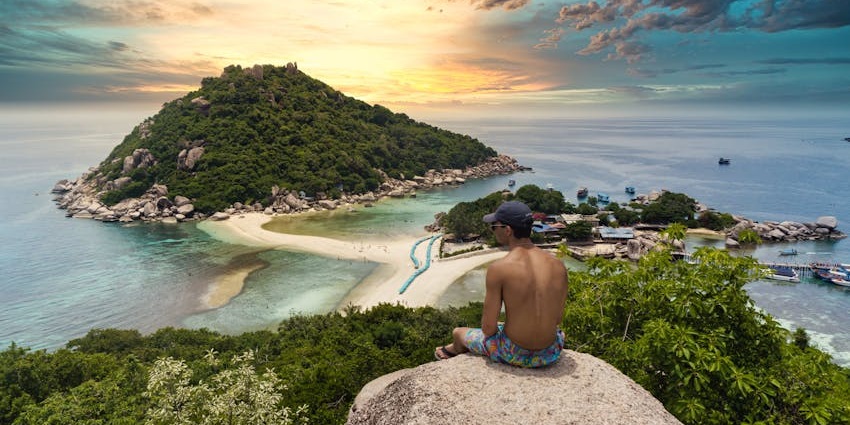 A person witnessing scenic beauty from a cliffs, a magnificent thing to do in Similan.