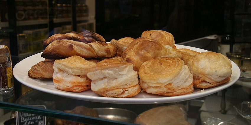 Golden, puffy Hojaldres served with cheese and sausage.