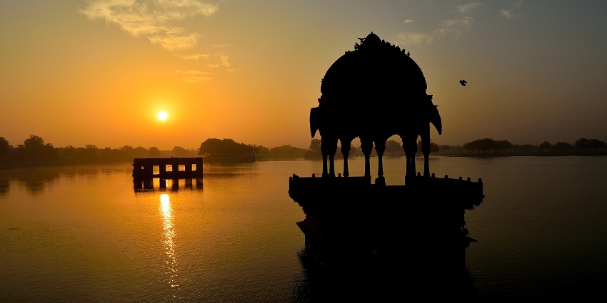 A beautiful sunset view over a lake in Jaisalmer, perfect for an evening visit.