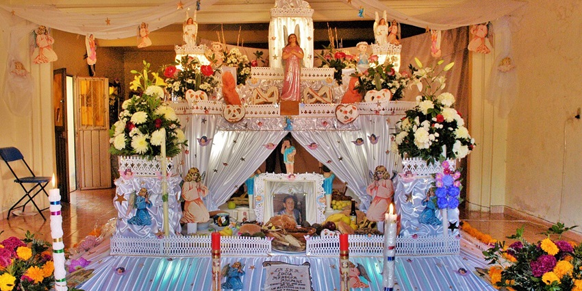 Enjoy the vibrant festivals at the traditional Day of the Dead altar in Huaquechula, Mexico.
