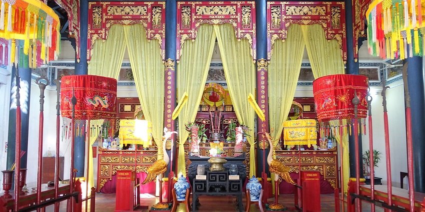 Colorful decorations inside the Hùng Kings' Temple Festival with an altar in the middle.