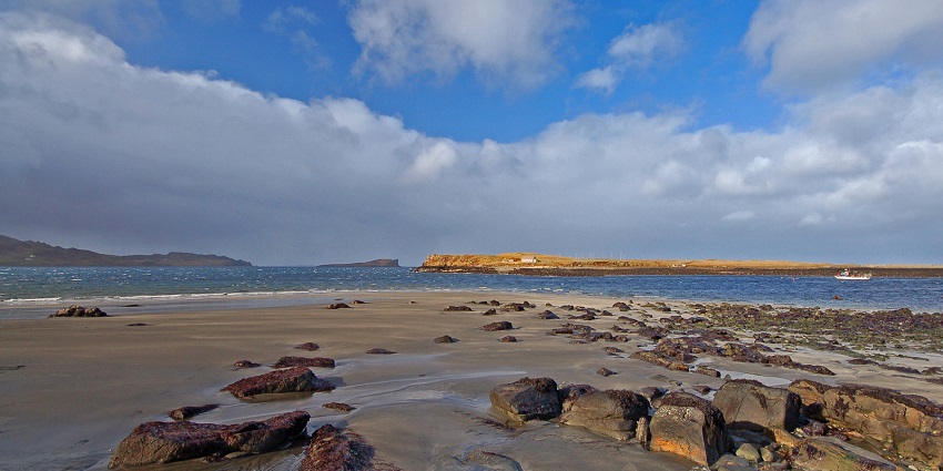 Shoreline where visitors can discover ancient dinosaur footprints preserved in rock, among the best things to do in Skye.