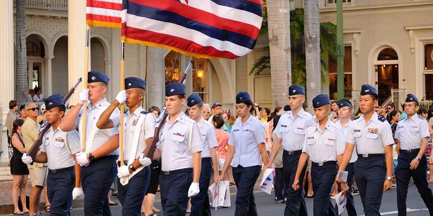 A military contingent participates in a street parade celebrating its country’s Independence Day
