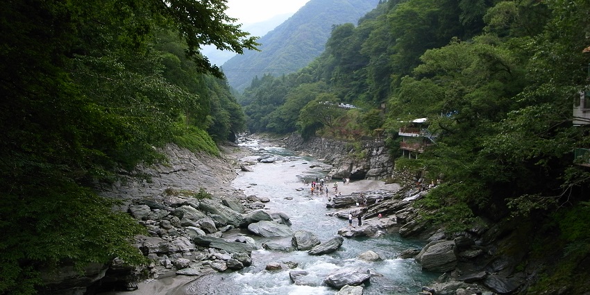 A scenic image of Iya Valley, one of the most stunning valleys in Japan, surrounded by mountains.