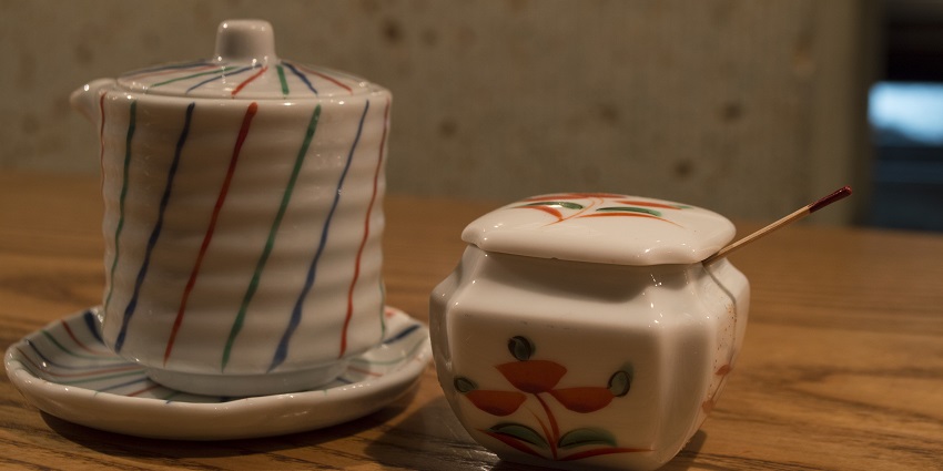 A collection of hand-painted Japanese bowls and mugs, often listed as top items bought in Japan.