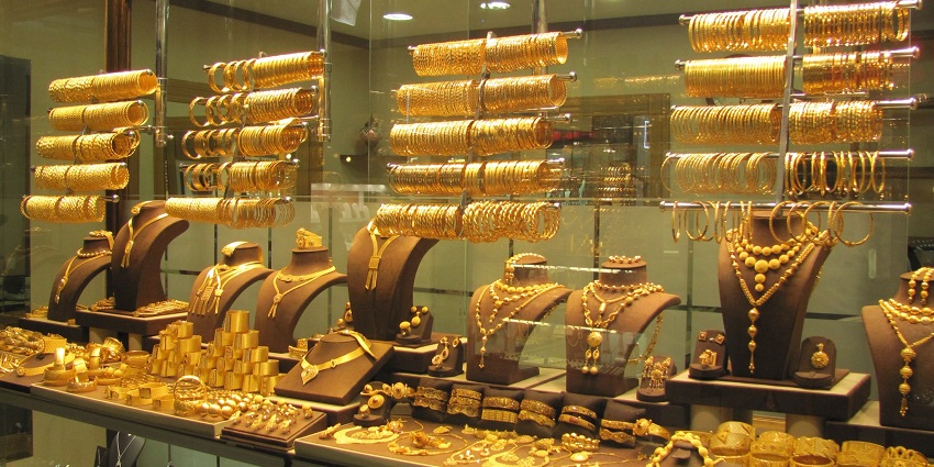 Gold and silver Turkish jewellery with gemstones and Ottoman-style engravings.
