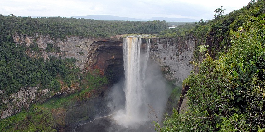 Kaieteur Falls plunging off a cliff, surrounded by lush rainforest in central Guyana