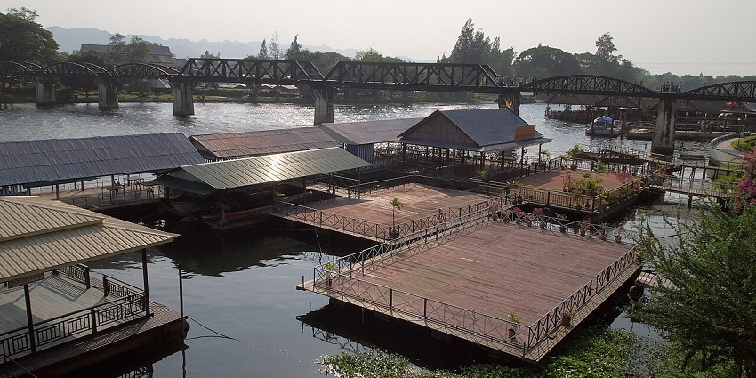 The crystal clear water of the Kwai River at Kanchanaburi is brimming with the golden hues of the sun.