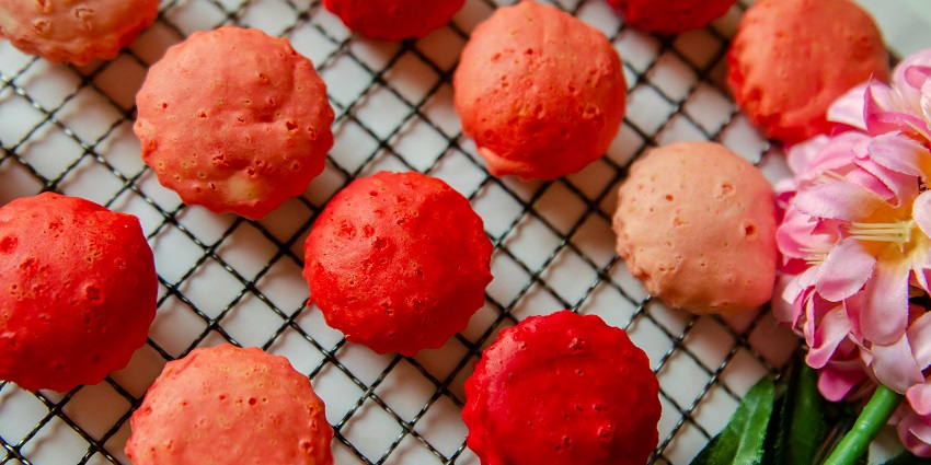 An image showing a food item resembling kuih bahulu cakes, a famous thing to buy in Malaysia.