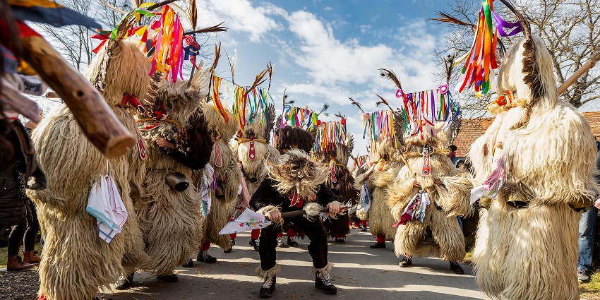 Kurenti in fur-covered costumes with cowbells parade through Ptuj during Kurentovanje, one of the most famous festivals in Slovenia.