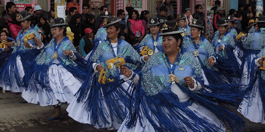 Dancers in costumes perform at Peru’s La Fiesta Candelaria with colourful parades and music.