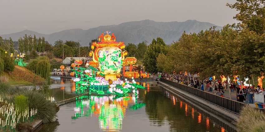 Festival de Luces in Chile with a lake in the centre and many people gathered on the right