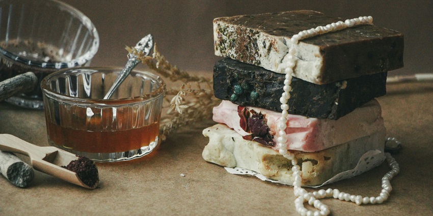 Natural Greek skincare products using olive oil, herbs, and traditional magnificence recipes.