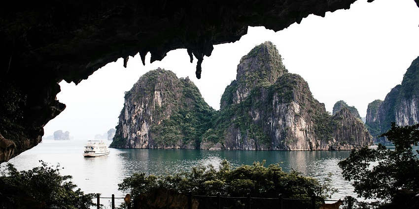 Ha Long Bay in Vietnam features towering limestone karsts and emerald waters