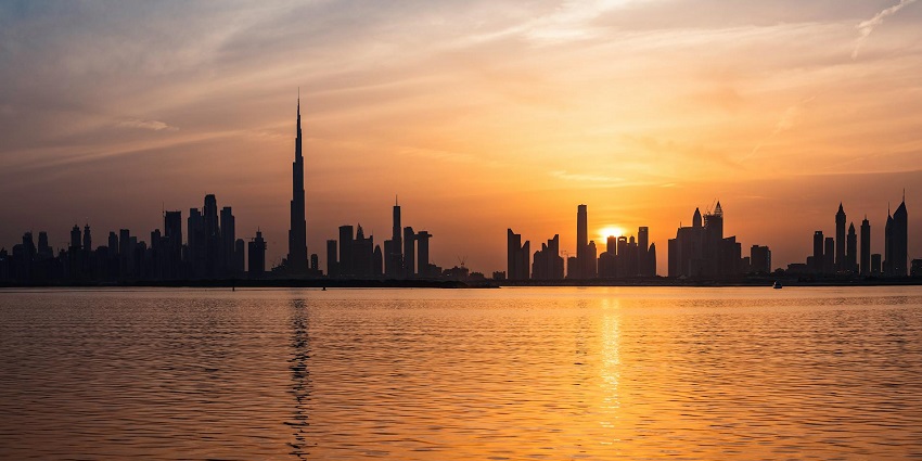 Scenic image of the Dubai city during the sunset over the horizon in Arabia