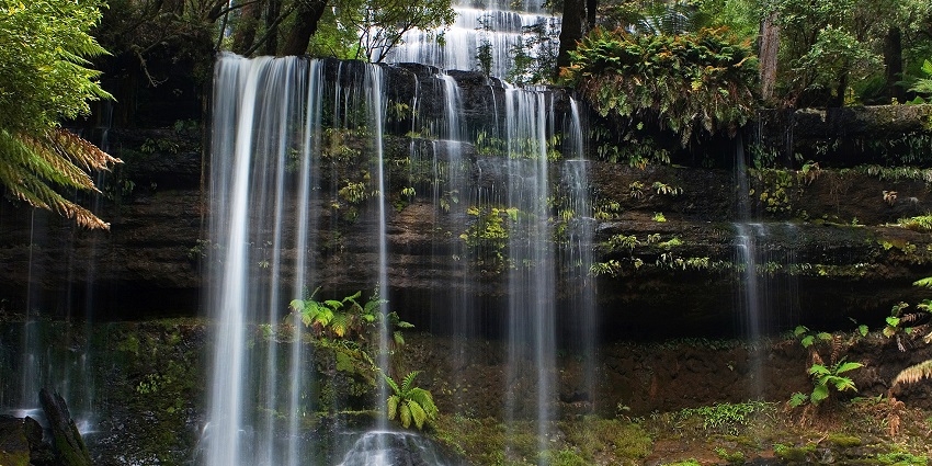 Lumangwe Falls cascade on rocks into a clear stream, one of the best waterfalls in Zambia.