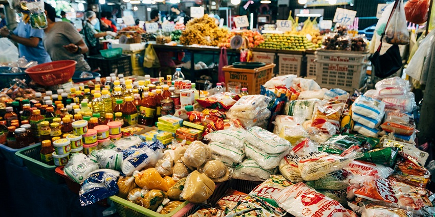 Enjoy street shopping in Vizag at MVP Colony Market with stalls selling groceries and clothes.