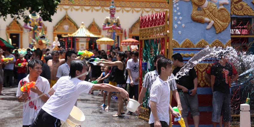 People throwing water on each other at Malaysia Water Festival one of the top festivals in Malaysia.