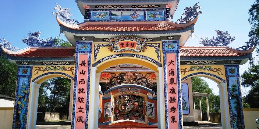 Witness the famous Tam Quan Gate, vibrant colors, and intricate carvings