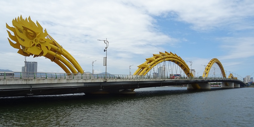 Close-up of the dragon-shaped head of the Dragon Bridge, showcasing detailed scales