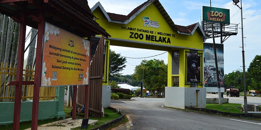 Entrance view of Malacca Zoo and Bird Farm featuring signage and lush greenery Zoos in Malaysia