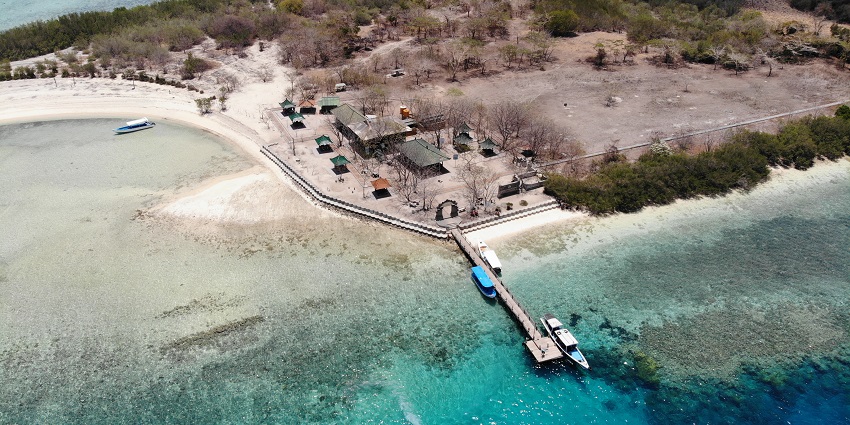 Ships exploring vibrant coral reefs in the clear blue waters - one of the places to visit near Bali.