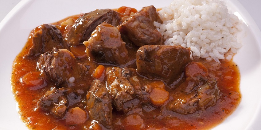 An image showing Moravský vrabec, pork pieces with cabbage and dumplings.