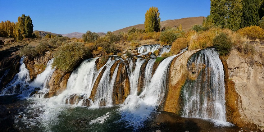 One of the waterfalls in Turkey dividing into multiple streams cascading into the river.