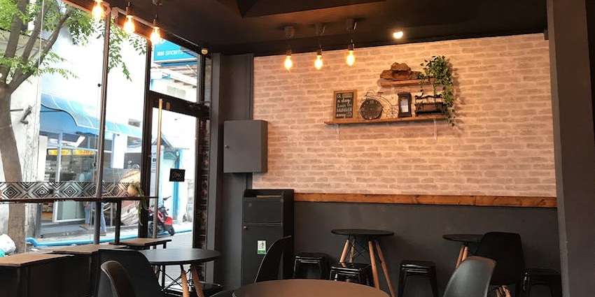 Cozy café with dim lighting and music, ideal for evening hangouts with friends
