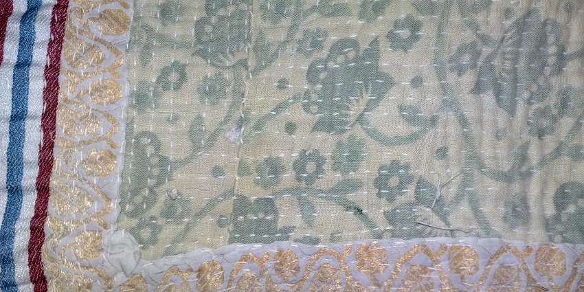 Unveil the charm of Nakshi Kantha embroidery, a must-buy when exploring things to do in Dhaka.