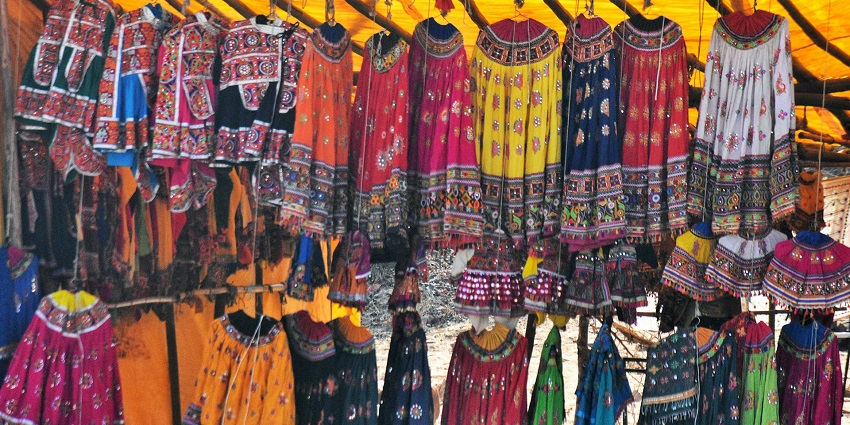 Experience street shopping in Vizag at Nehru Bazaar with stalls offering clothes and utensils.