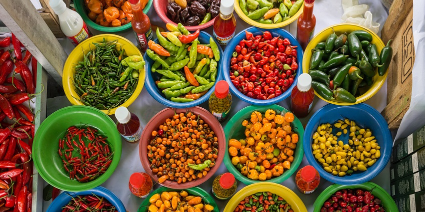 Colourful spices like turmeric and Sichuan pepper are displayed in a Kathmandu spice market.