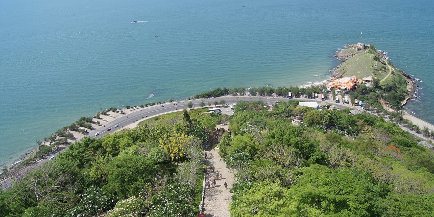 View of the Nphinh phong cape, with lush greenery and coastline on the other side