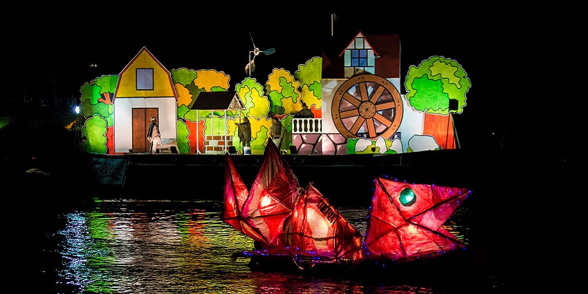 Decorated boats with lights float along Valdivia’s river during one of the festivals in Chile.