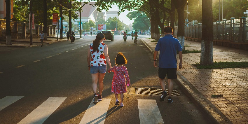 A family walking along the streets of Buon Ma Thuot, rendering picturesque views.