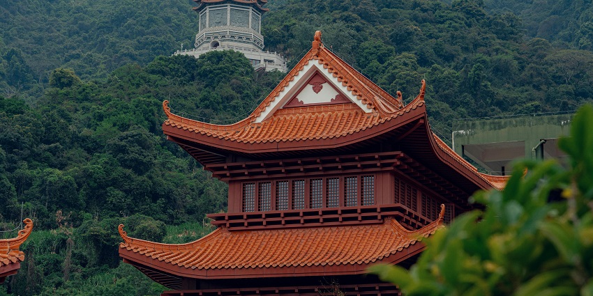 Majestic view of the pagoda surrounded by lush greenery and dense forests