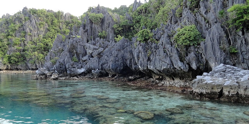 Experience the peaceful waters of the Small Lagoon in El Nido by paddleboarding.