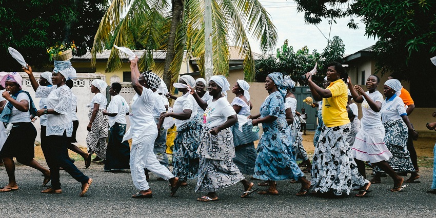 Participants in vibrant costumes dance to Afro-Caribbean rhythms during the Maypole celebration, among the famous festivals in Nicaragua.