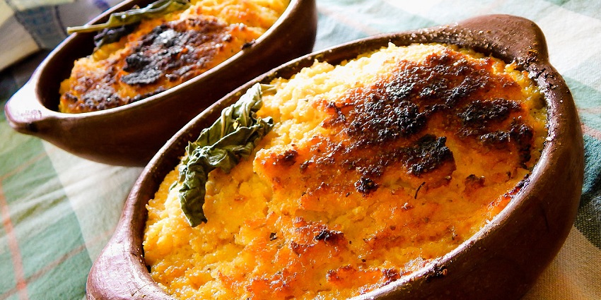 An image of Pastel de Choclo, a baked corn pie with meat and eggs inside.
