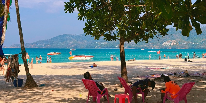 A glimpse of the serene Patong Beach featuring turquoise-blue waters and pristine sands.