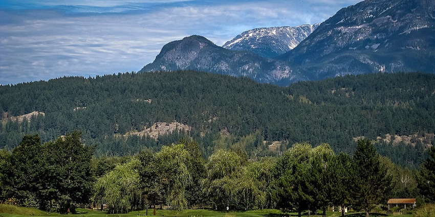 Beautiful view of Pemberton with mountain backdrops, open fields, and lush natural scenery.