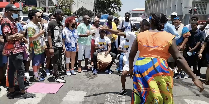 Garifuna dancers in traditional dress performing Punta rhythms in Roatán.