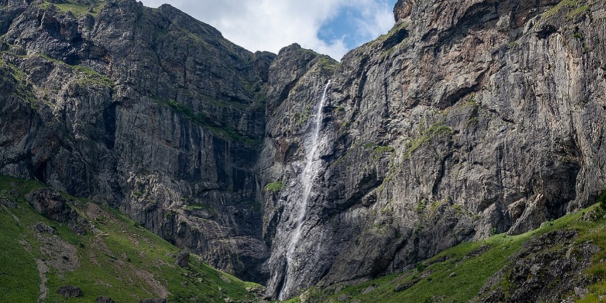 Water cascading from the very high cliffs of Raysko Praskalo waterfall in Bulgaria