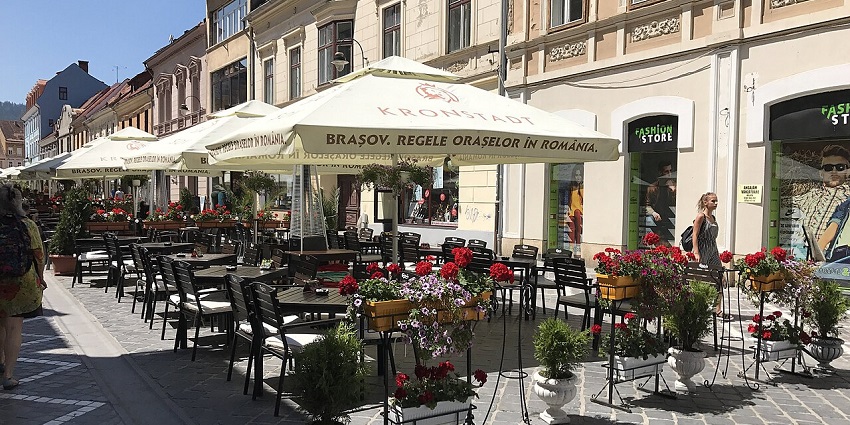 Charming cafes on Republicii Street offer a Cosy ambiance and vibrant vibes in Brasov.