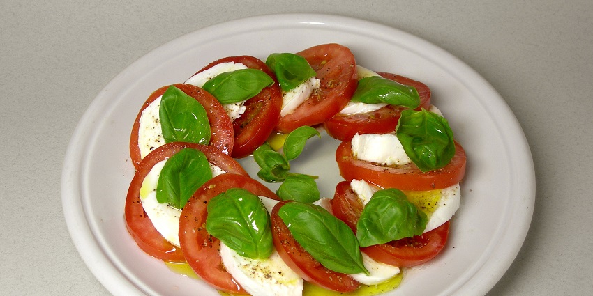 Unwind at a cosy taverna on Capri, enjoying local dishes and the island's laid-back atmosphere