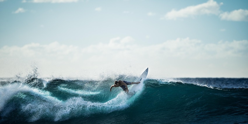 An image resembling a person surfing, which is one of the best things to do in Avon, NC.