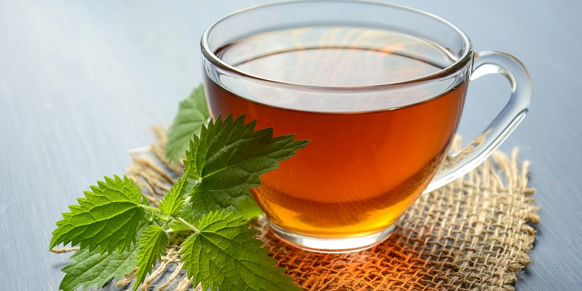 Rooibos tea served in a glass, highlighting its rich red-brown colour and natural clarity.