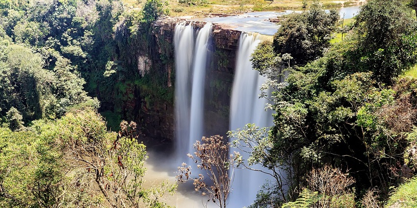 A view of Salto Kama from a nearby hill shows the milky appearance of the falling water streams